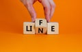Lifeline, line of life symbol. Businessman hand turns cubes and changes the word `life` to `line`. Beautiful orange table, ora Royalty Free Stock Photo