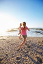 Lifes a beach, enjoy the waves. two little girls having fun on the beach.