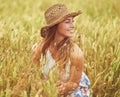 Lifes better in the country. a young woman in a wheat field. Royalty Free Stock Photo