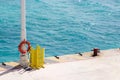 Lifesaver on pole on ferry dock, Playa del Carmen, Mexico