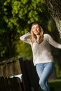 Lifestile outdoor portrait of young beautiful woman on natural b Royalty Free Stock Photo