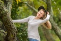 Lifestile outdoor portrait of young beautiful woman on natural b