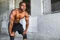 Lifestyle of african american athlete preparing for run, jogging, intense conviction, determination, serious stare, powerful eyes Royalty Free Stock Photo