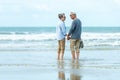 Lifestyle asian senior couple happy walking and relax on the beach.