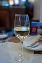 Lifestyle of beautiful Vienna, glass of white dry Austrian wine served in old Viennese-style cafe in Vienna, Austria