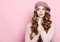 Lifestyle, beauty and people concept: Beauty girl with curly perfect hairstyle wearing pink beret over white background Royalty Free Stock Photo