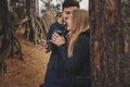 Lifestyle capture of happy couple drinking hot tea outdoor on cozy warm walk Royalty Free Stock Photo