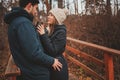 Lifestyle capture of happy couple drinking hot tea outdoor on cozy warm walk Royalty Free Stock Photo