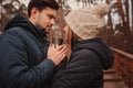 Lifestyle capture of happy couple drinking hot tea outdoor on cozy warm walk Royalty Free Stock Photo