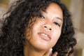 Lifestyle close up head portrait of young beautiful and mixed ethnicity latin and African American woman with gorgeous curly Royalty Free Stock Photo