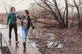 Lifestyle close up outdoor portrait of young happy loving couple walking in early spring Royalty Free Stock Photo