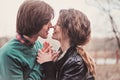 Lifestyle close up outdoor portrait of young loving couple kissing Royalty Free Stock Photo