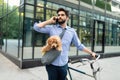 Lifestyle, transport, communication and people concept . Young man with bicycle and smartphone on city street