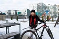 Lifestyle concept, Caucasian woman frolicking while riding a bicycle in winter