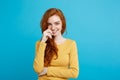 Lifestyle concept - Close up Portrait young beautiful attractive ginger red hair girl playing with her hair with shyness Royalty Free Stock Photo