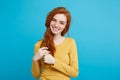 Lifestyle concept - Close up Portrait young beautiful attractive ginger red hair girl playing with her hair with shyness Royalty Free Stock Photo