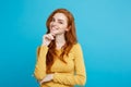 Lifestyle concept - Close up Portrait young beautiful attractive ginger red hair girl playing with her hair with shyness Royalty Free Stock Photo