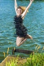 Lifestyle Concept and Ideas: Blond Woman in Dress Jumping N Royalty Free Stock Photo