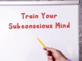 Lifestyle concept meaning Train Your Subconscious Mind with phrase on the page