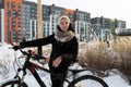 Lifestyle concept, young woman riding a sports bike in winter Royalty Free Stock Photo