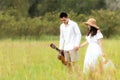 Lifestyle couple picnic sunny time. Asian young couple having fun