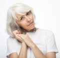 Lifestyle, emotion and old people concept: Portrait of senior gray-haired woman over white background Royalty Free Stock Photo