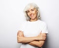 Lifestyle, emotion and old people concept: Portrait of senior gray-haired woman over white background Royalty Free Stock Photo