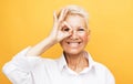 lifestyle, emotion and old people concept: Senior grey-haired woman smiling happy doing ok sign with hand Royalty Free Stock Photo