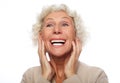 Lifestyle, emotion and people concept: Grey haired old nice beautiful laughing woman. Isolated over vwhite background. Royalty Free Stock Photo