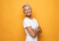 Lifestyle, emotion and people concept: Grey haired old nice beautiful laughing woman. Isolated over vwhite background. Royalty Free Stock Photo