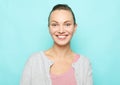 Lifestyle, emotion and people concept: Young cute smiling blond woman over blue background