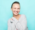 Lifestyle, emotion and people concept: Young cute smiling blond woman over blue background