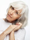 Lifestyle, emotion and old people concept: Portrait of senior gray-haired woman over white background Royalty Free Stock Photo