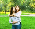 portrait of mother and daughter hugging, summer time, park Royalty Free Stock Photo