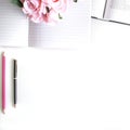 Flat lay with different accessories; flower bouquet, pink roses, open book, Bible Royalty Free Stock Photo