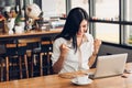 Lifestyle freelance business woman working with laptop computer he has glad on the job Royalty Free Stock Photo