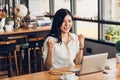 Lifestyle freelance business woman working with laptop computer he has glad on the job Royalty Free Stock Photo