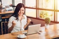 Lifestyle freelance business woman working with laptop computer he has glad on the job Royalty Free Stock Photo