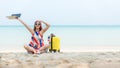 Lifestyle freelance woman raise arms relax after using laptop working on the beach. Royalty Free Stock Photo