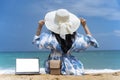 Lifestyle freelance woman using laptop working and relax on the beach. Asian people success and together your work pastime and Royalty Free Stock Photo