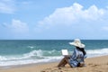 Lifestyle freelance woman using laptop working and relax on the beach. Asian people success and together your work pastime Royalty Free Stock Photo