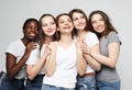 Lifestyle, friendship, emotion and people concept: five multiracial, african american, european and asian girls