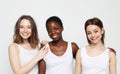 lifestyle, friendship and people concept - group of three girls friends of different nationalities