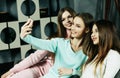 friendship, people and technology concept - happy friends or teenage girls with smartphone taking selfie at home Royalty Free Stock Photo