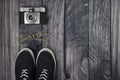 Lifestyle, hobbie, old analog photo camera, two sneakers and lavender