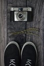 Lifestyle, hobbie, old analog photo camera, two sneakers and lavender