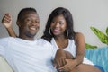 Lifestyle home portrait of young happy and successful romantic afro American couple in love relaxed sitting comfortable together Royalty Free Stock Photo