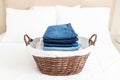 Clean and folded clothing in a laundry basket Royalty Free Stock Photo