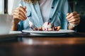 Lifestyle image of young woman eating cherry pie Royalty Free Stock Photo