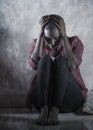 lifestyle indoors portrait of young sad and depressed black african American woman sitting at home floor feeling desperate and Royalty Free Stock Photo